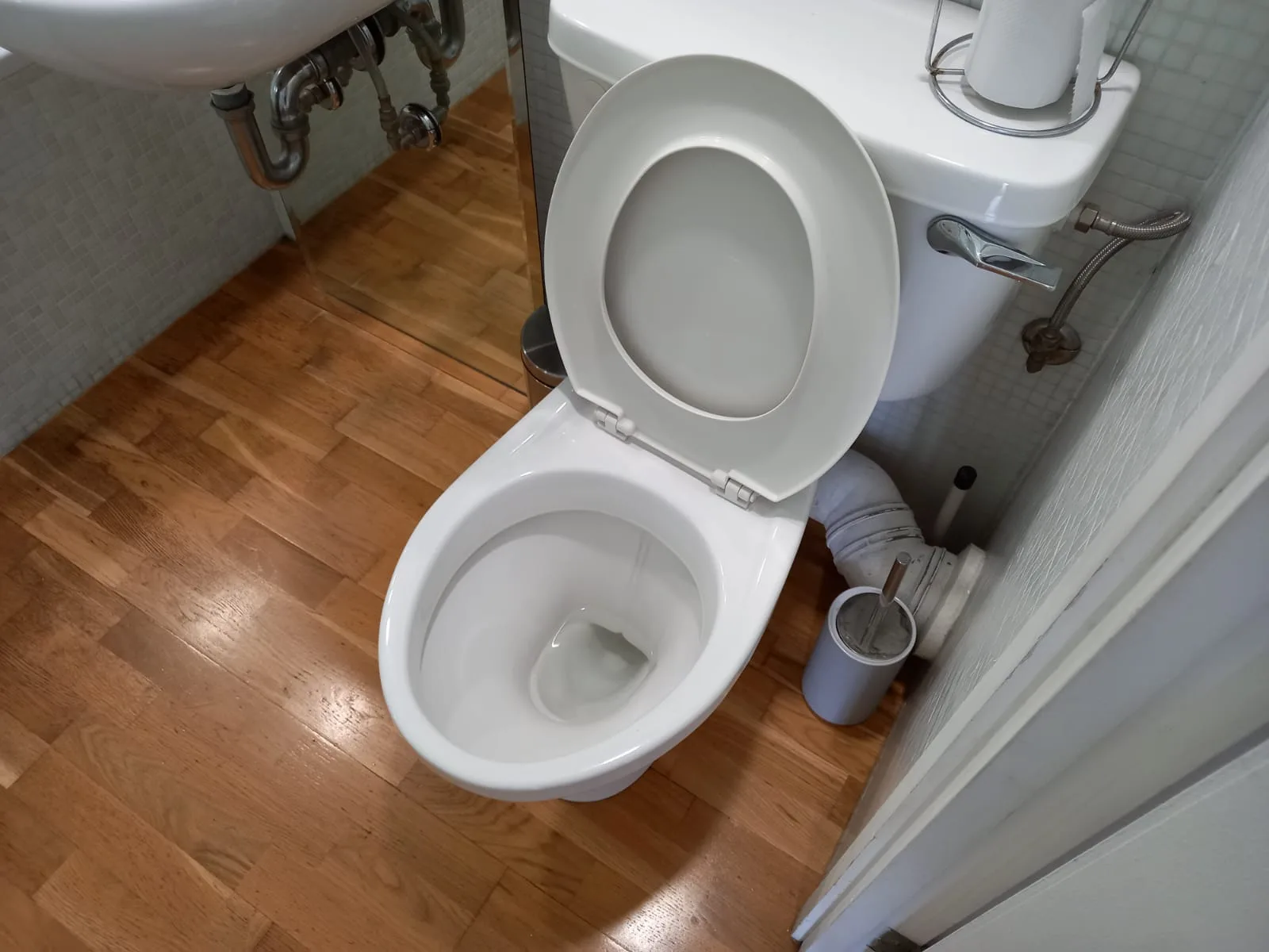 Toilet and bathroom floor cleaned by Lunara Essence Cleaning Services