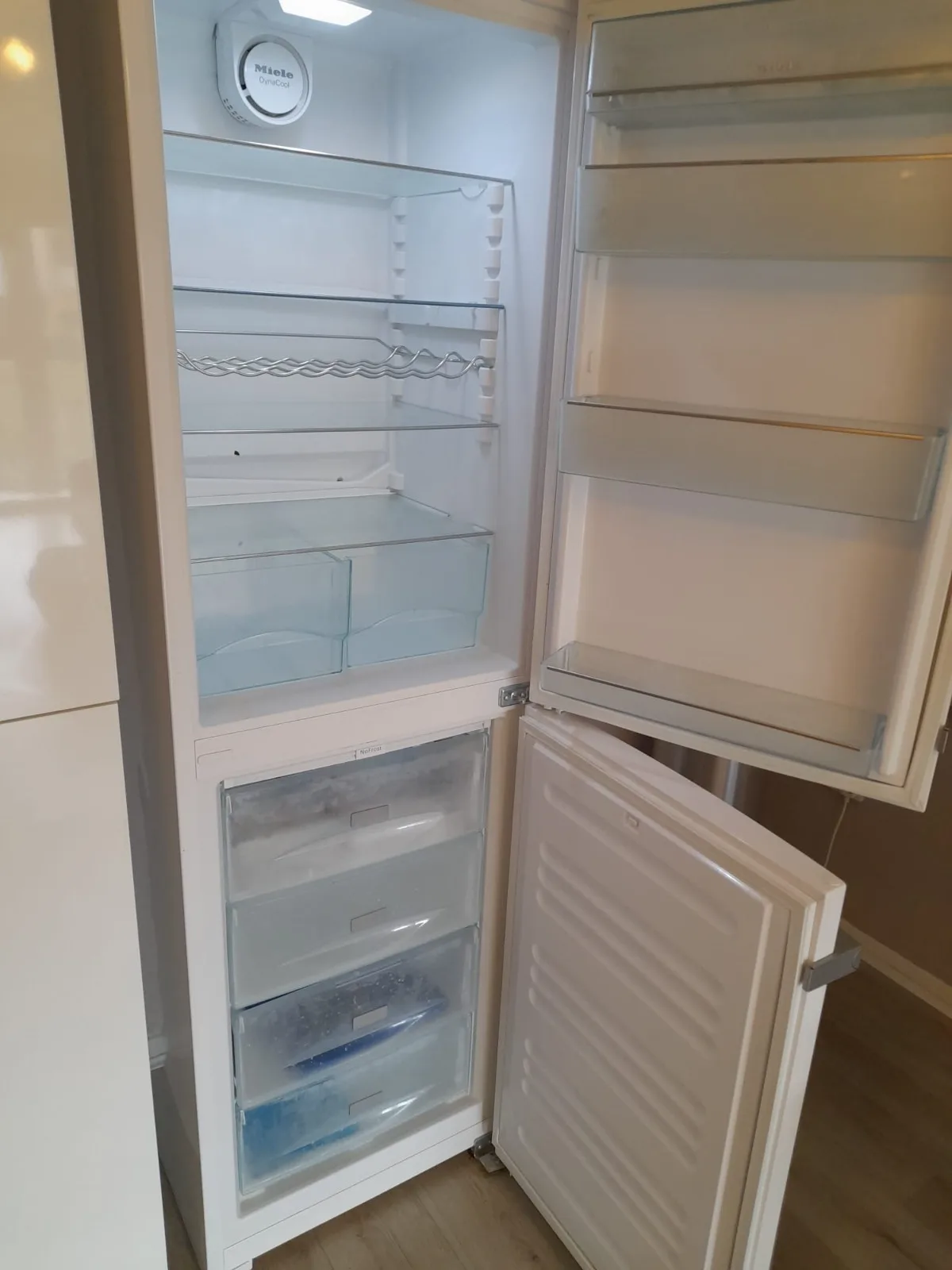 Refrigerator interior cleaned shelf by shelf